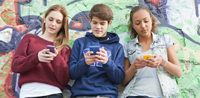 Teens using smartphone
